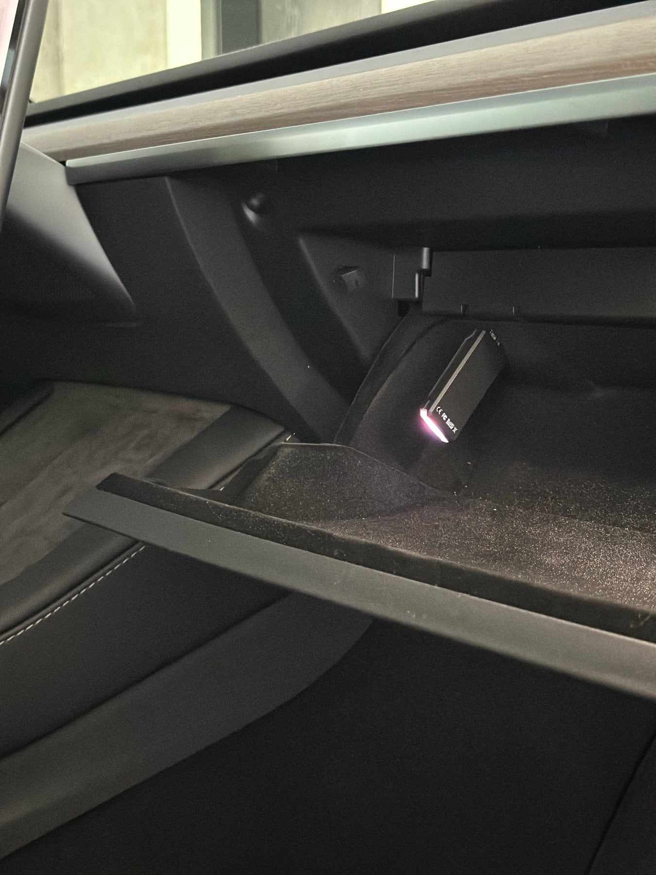 MATT3R K3Y plugged into the glovebox USB port of a Tesla